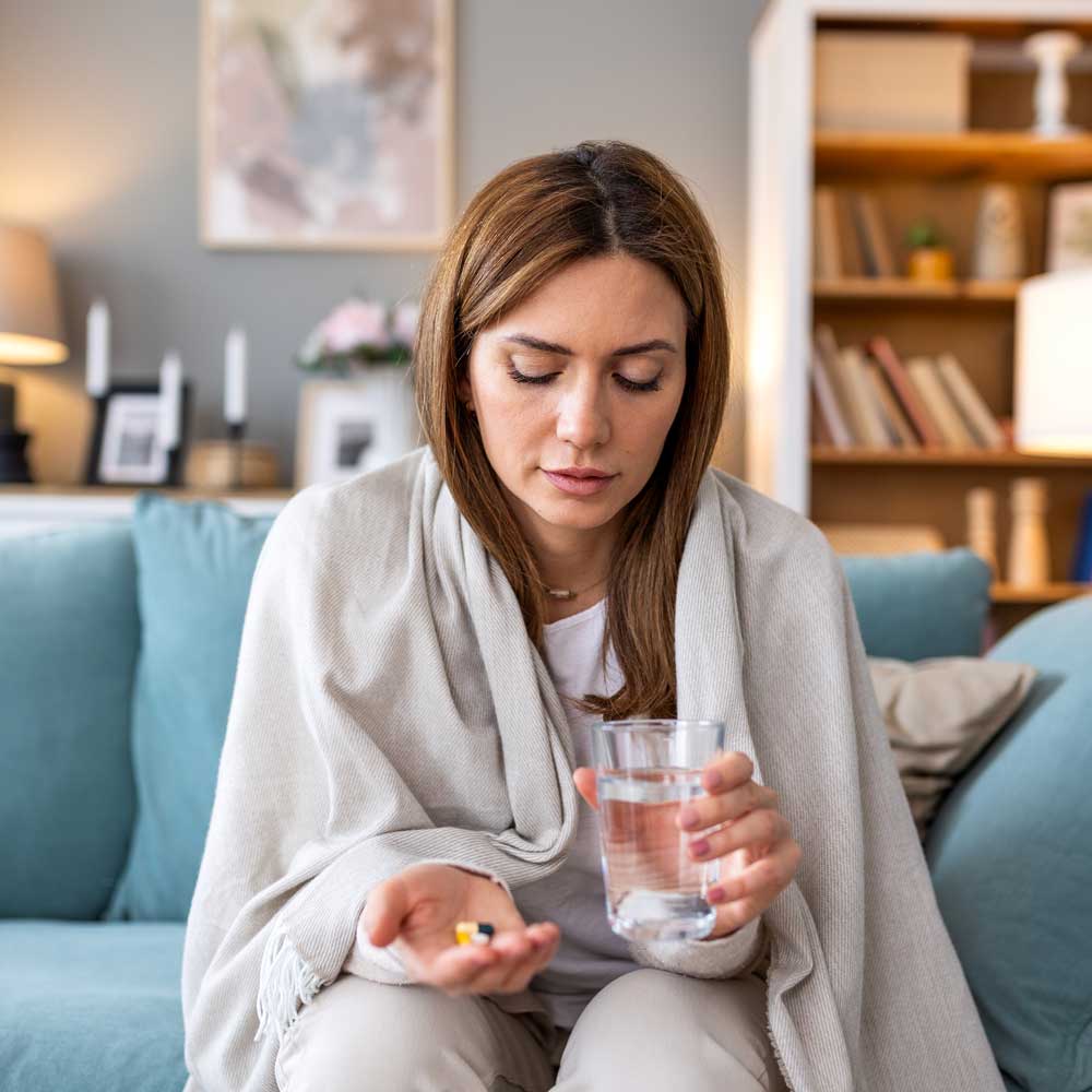 Woman taking daily medicine